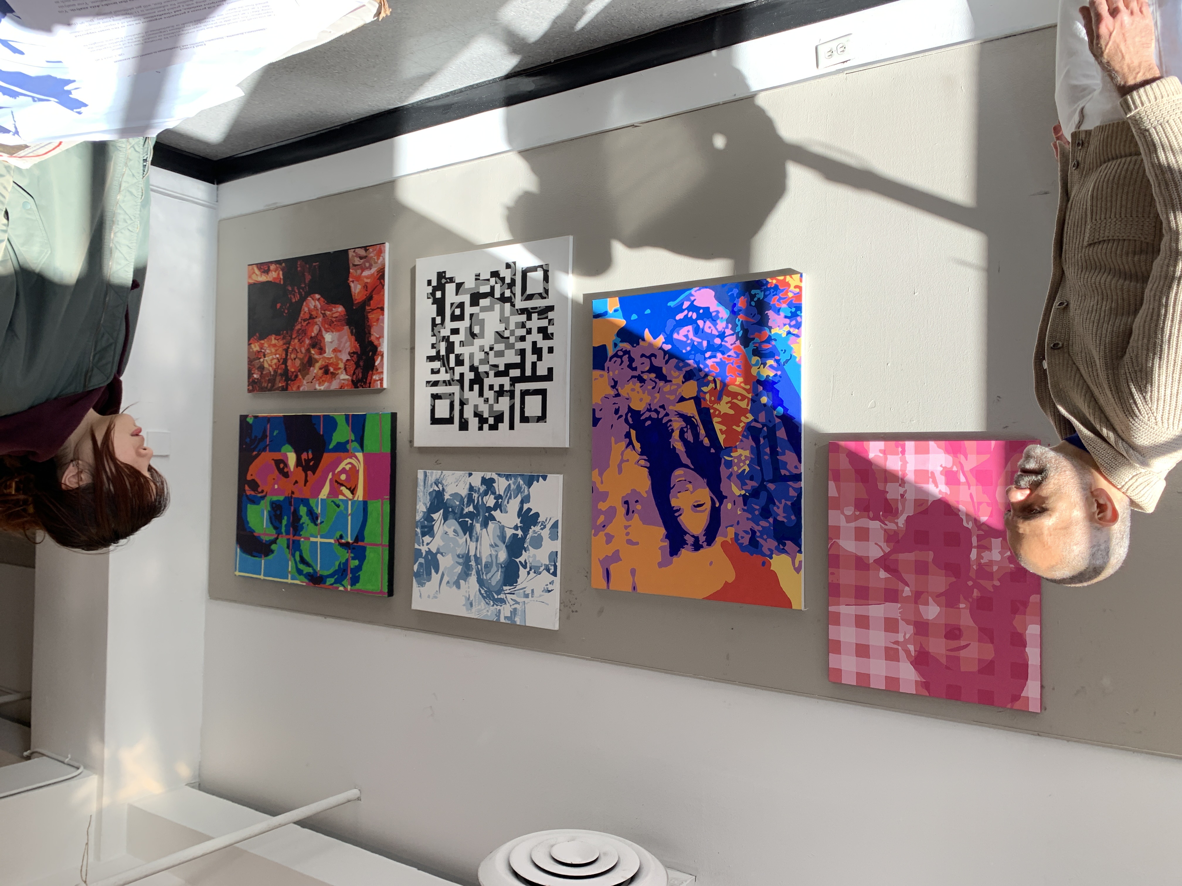 Wall of completed paintings, mine included